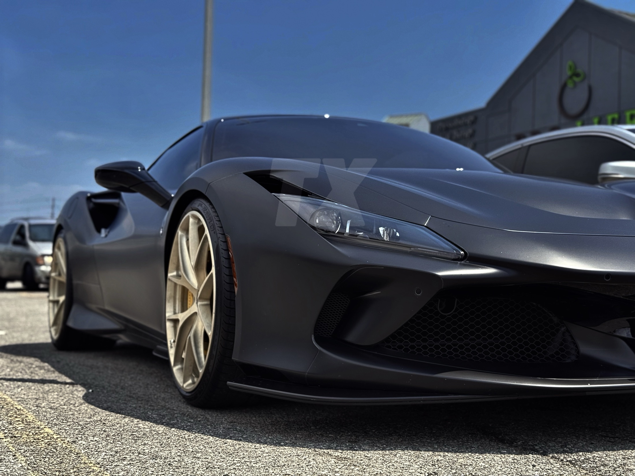 Matte black sports car with satin film finish
