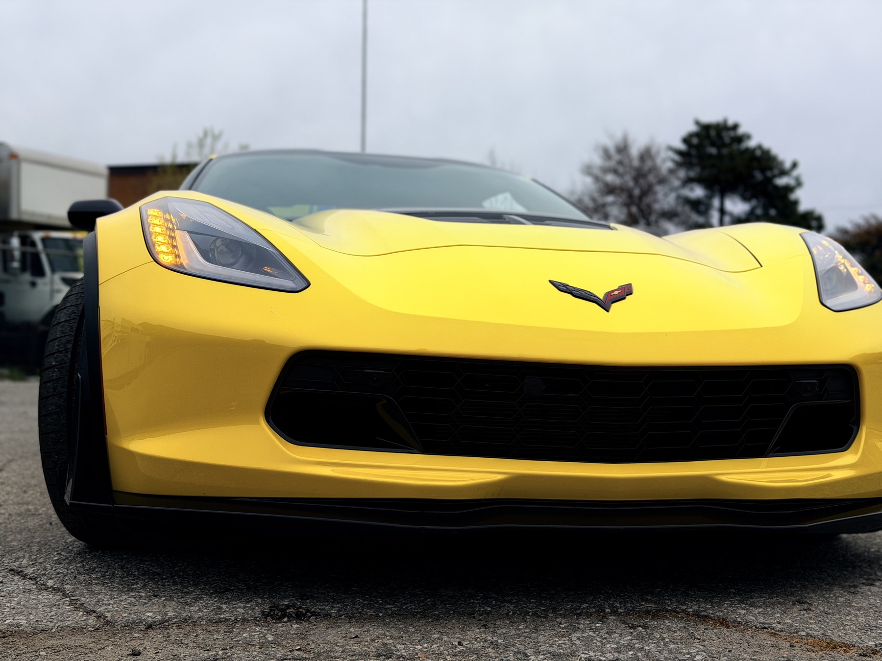 Yellow sports car protected with clear PPF