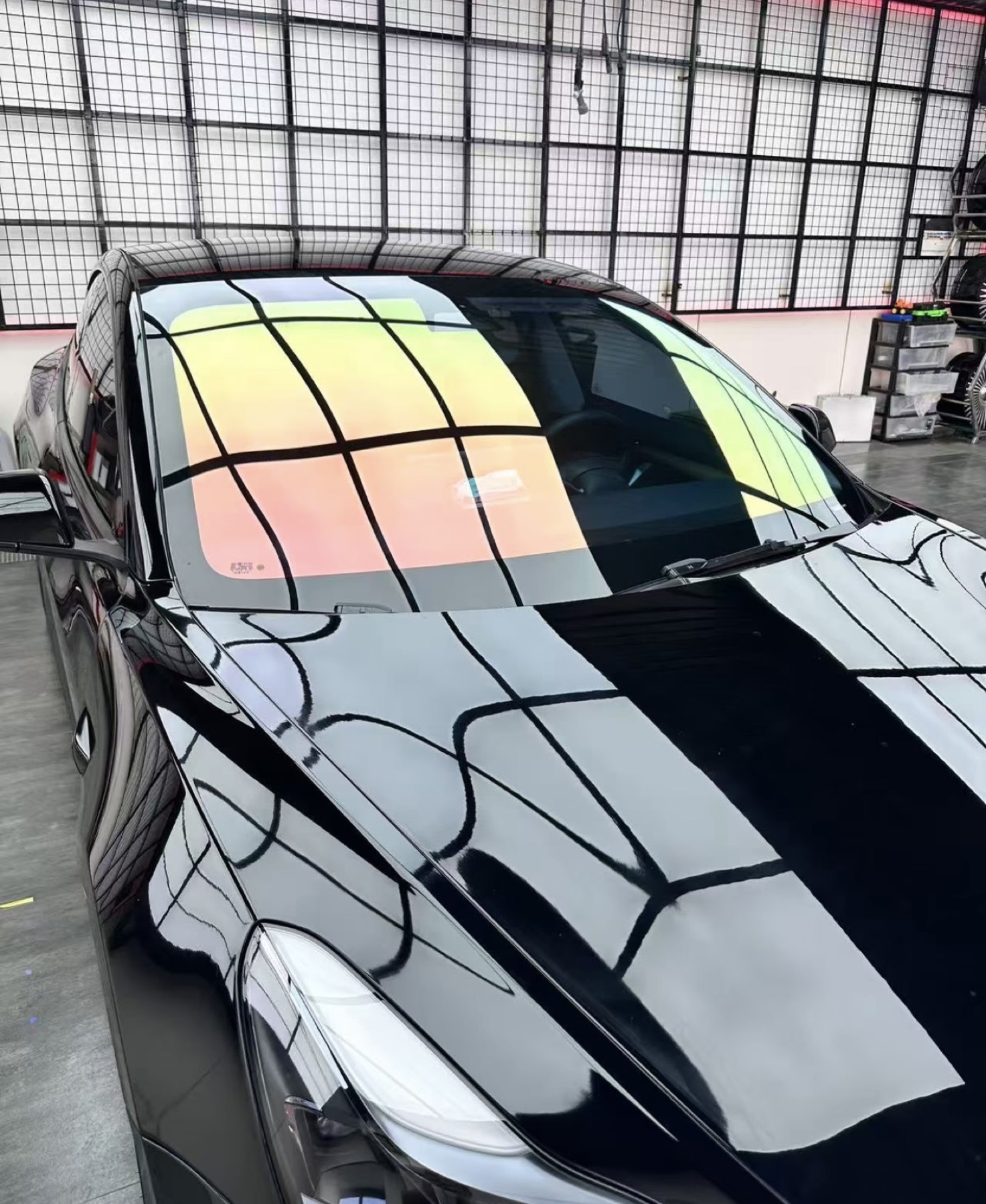 Specialty heat-rejecting windshield tint on a black vehicle