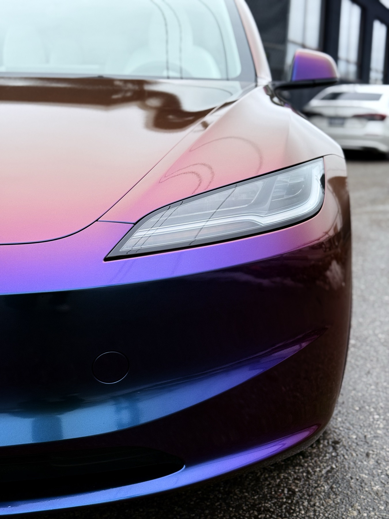 Chameleon color-shifting vinyl wrap on a vehicle front end